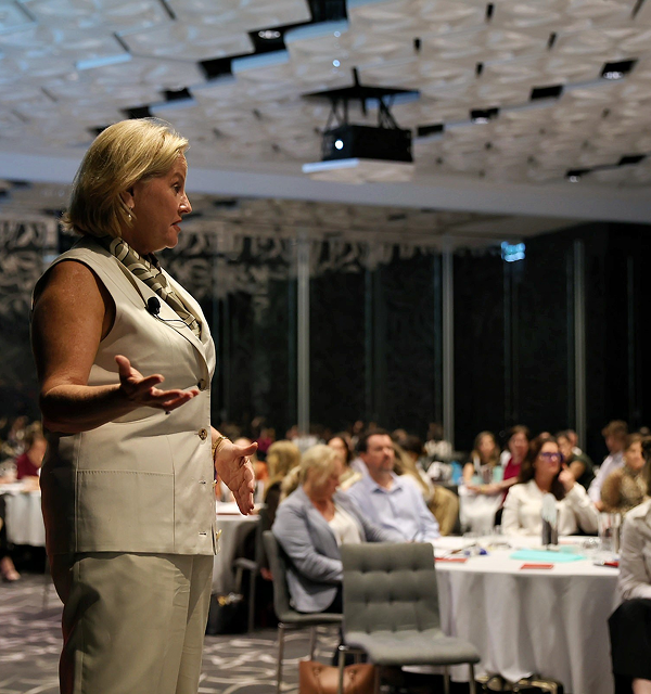 woman standing for a keynote